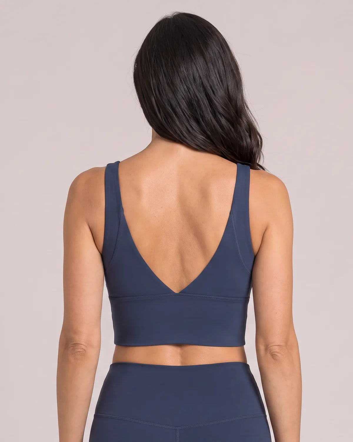 Luna Everyday Sports Bra in Navy, back view with deep V plunge back