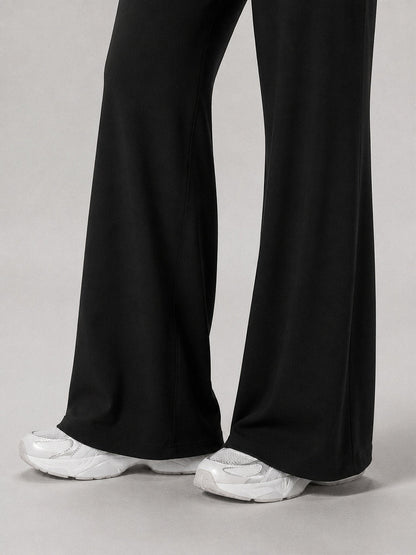 Boulevard Flare Pants in Black, wide flare hem over sneakers